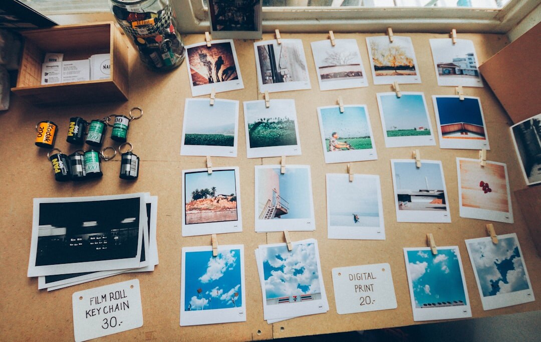 Planning board with printed photographs pinned and connected with string