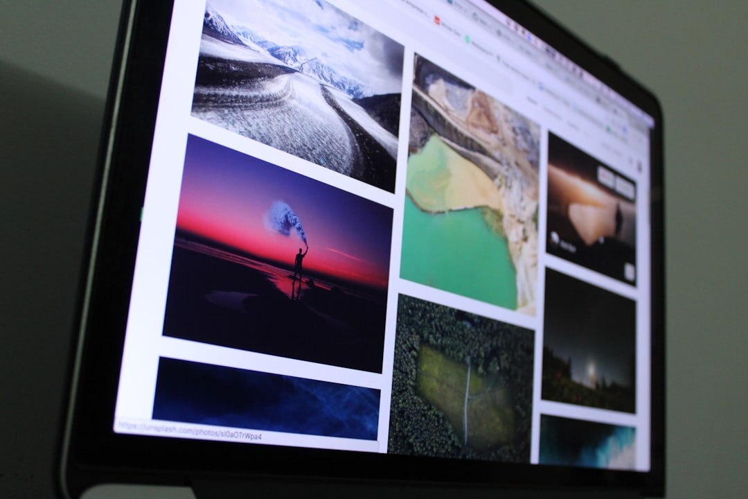 Close up of a computer screen showing a grid of thumbnail news photographs