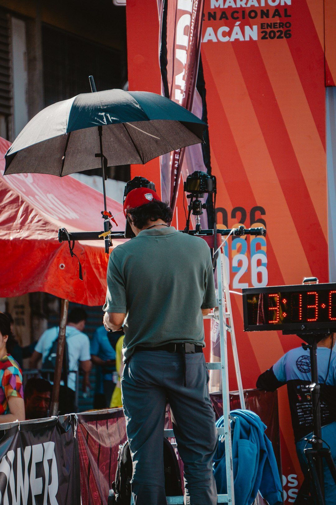 Reporter and camera operator covering a live outdoor event