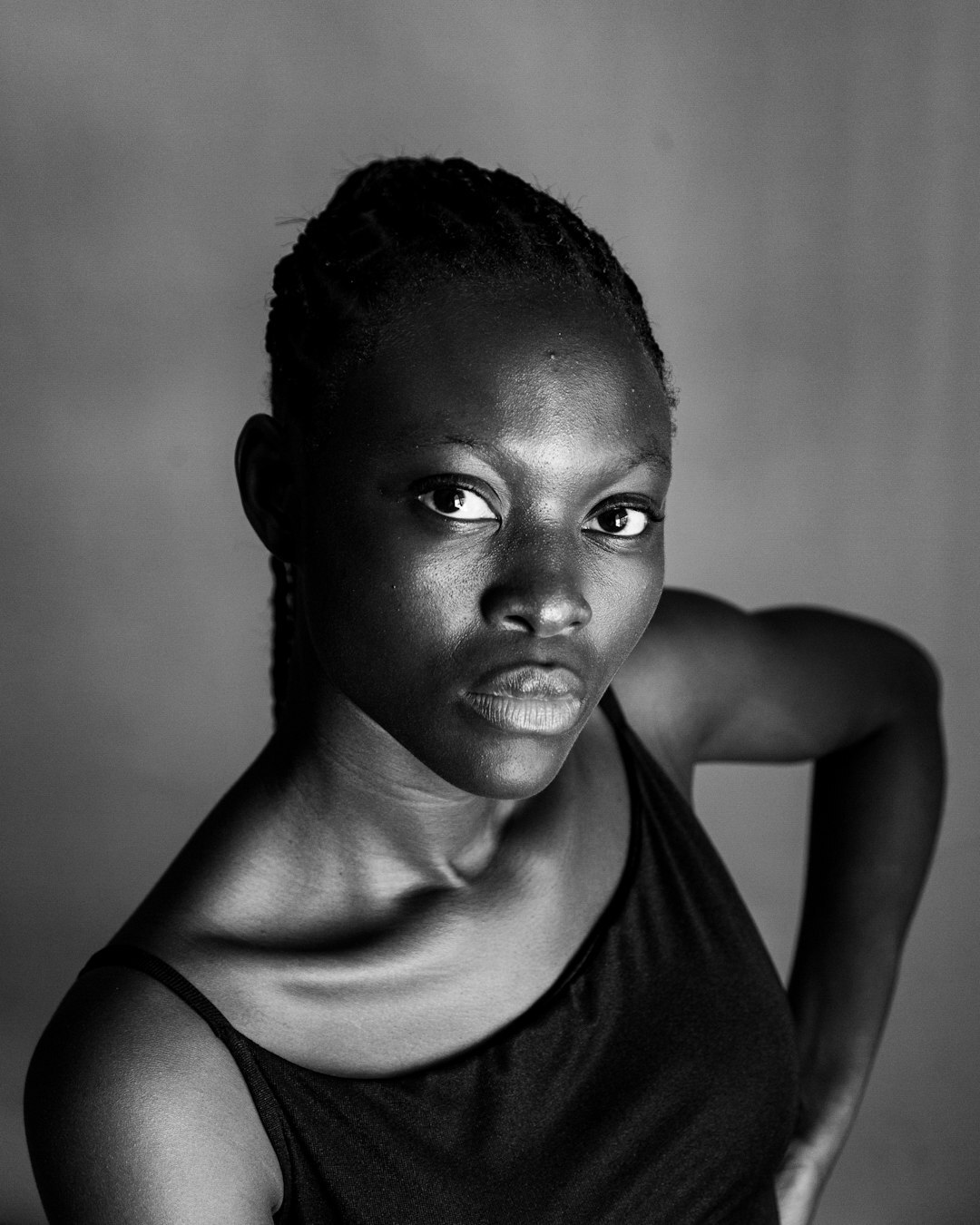 Studio portrait of a young African photo desk coordinator